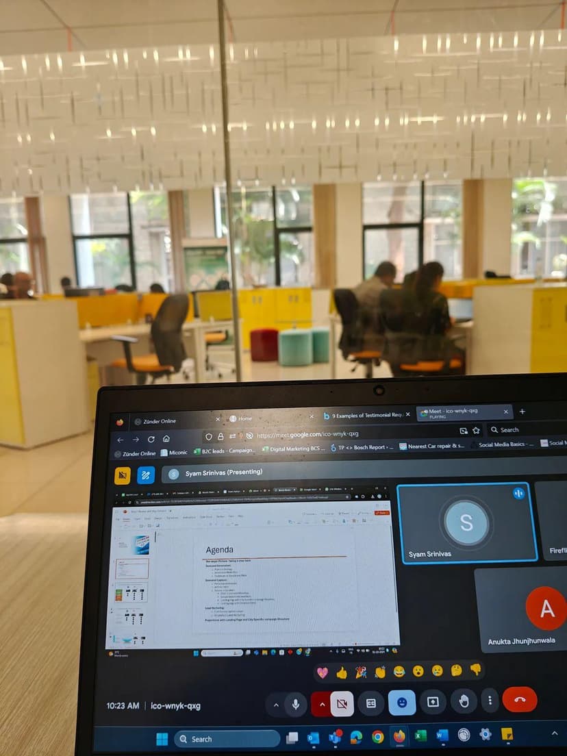 Laptop on a desk during a team video call in the office